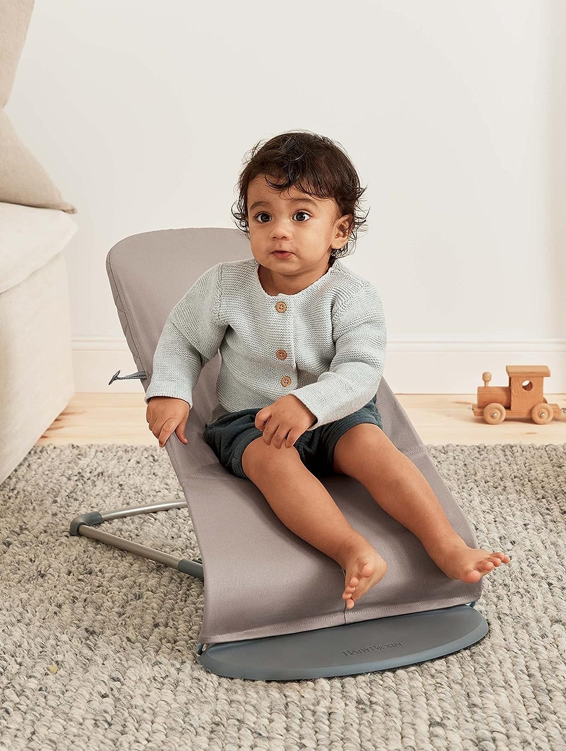 Lightweight frame of BabyBjörn Bouncer Bliss sand gray for effortless transport.