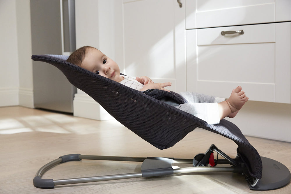 Fabric seat is machine washable for busy parents.