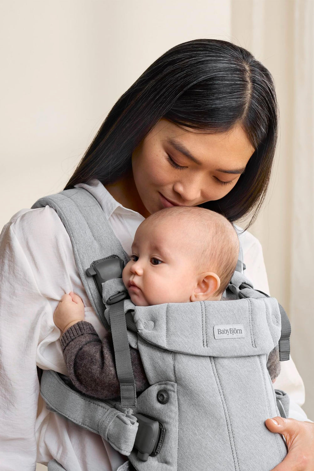 BabyBjörn Harmony four-position compatibility shown for newborn to back carry.