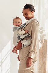 BabyBjörn Harmony newborn-facing-in setup demonstrates closeness and security