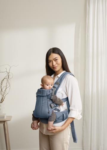BabyBjörn Harmony shoulder strap adjustment shows comfortable wear.