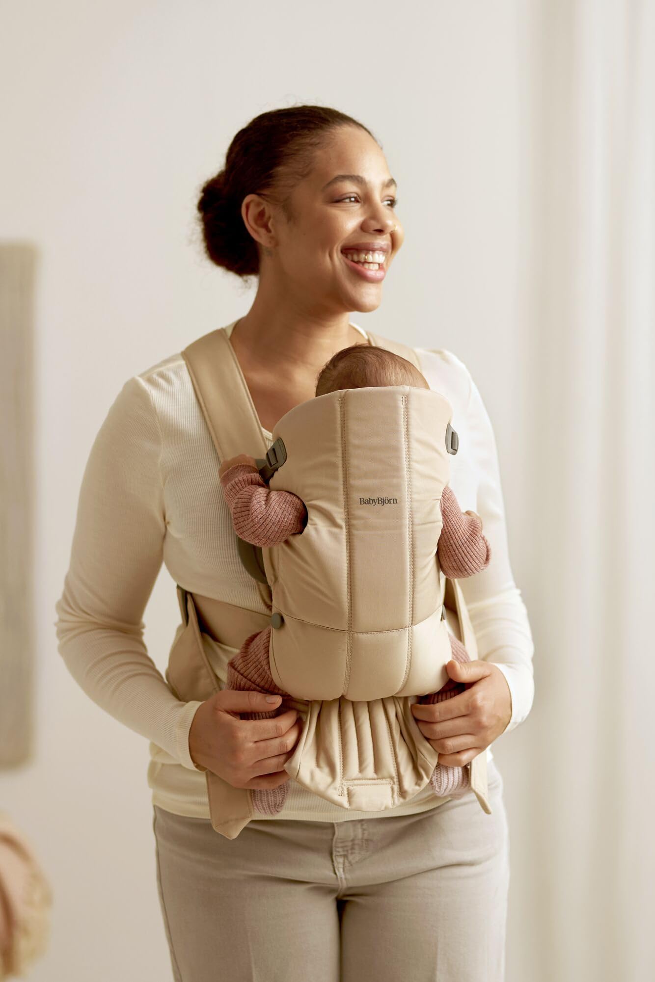 Compact storage view of BabyBjörn Mini beige woven for travel