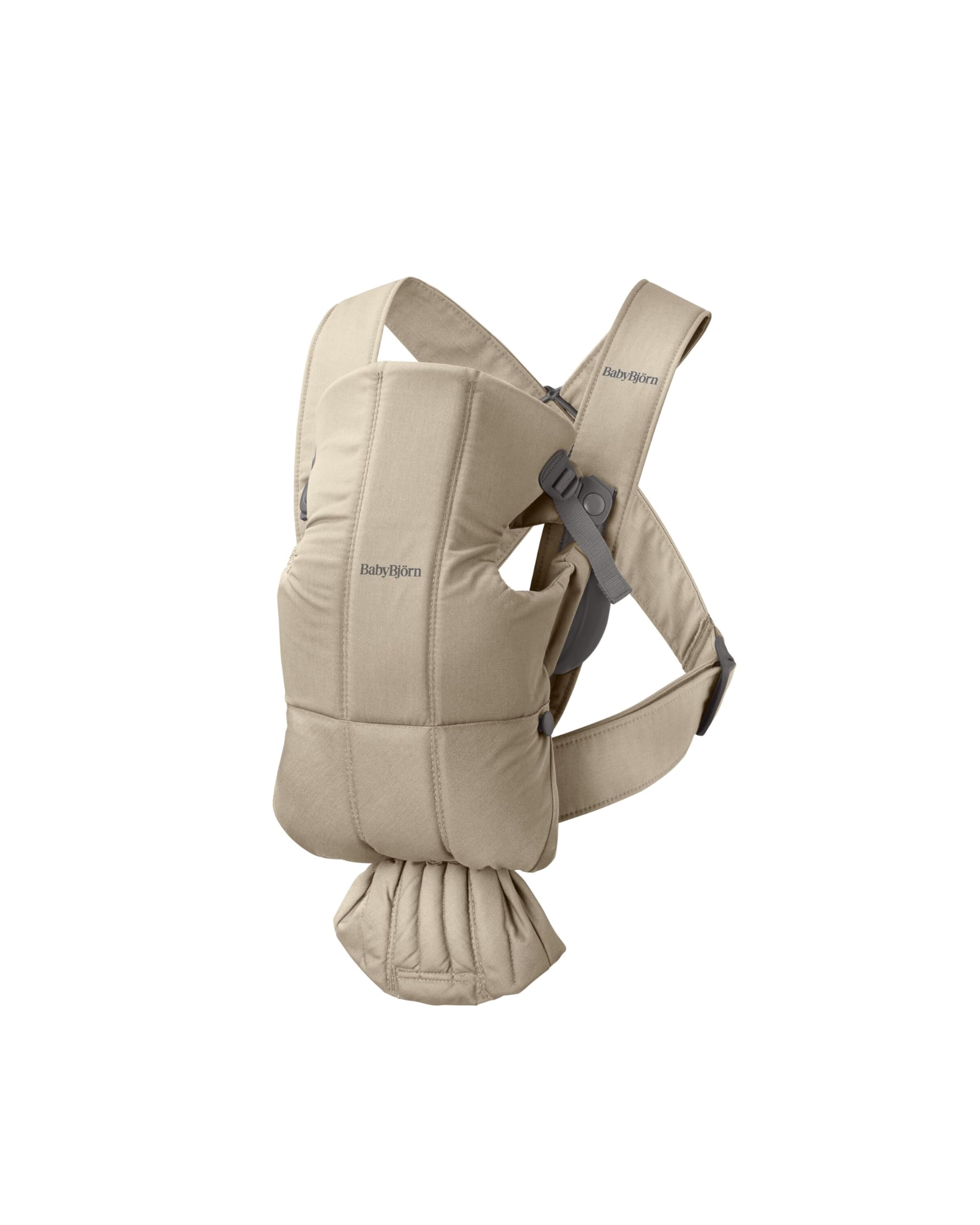 BabyBjörn Mini beige woven front view highlighting compact newborn carrier
