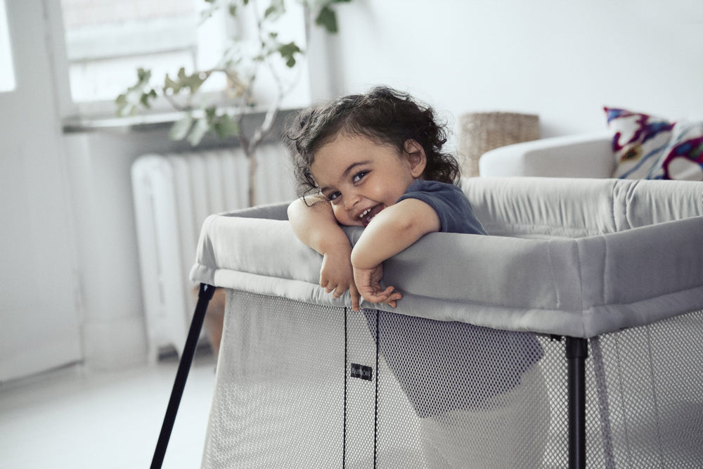 BabyBjorn Travel Crib Light silver mattress provides soft, comfy sleep for baby.