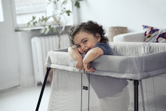 BabyBjorn Travel Crib Light silver mattress provides soft, comfy sleep for baby.