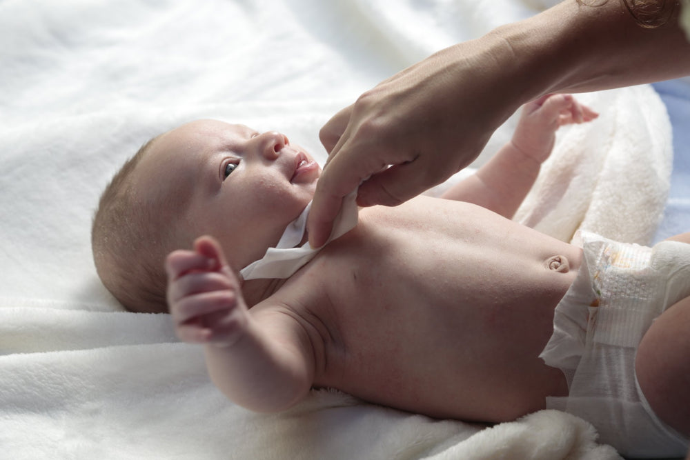 BabyGanics fragrance-free wipes in use demonstrates quick diaper changes.