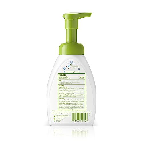 Hands using BabyGanics fragrance-free sanitizer for sensitive skin and quick cleanliness.