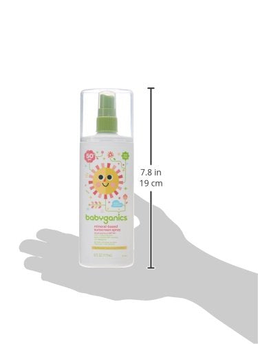 Babyganics sunscreen spray on a sunny beach day with kids.