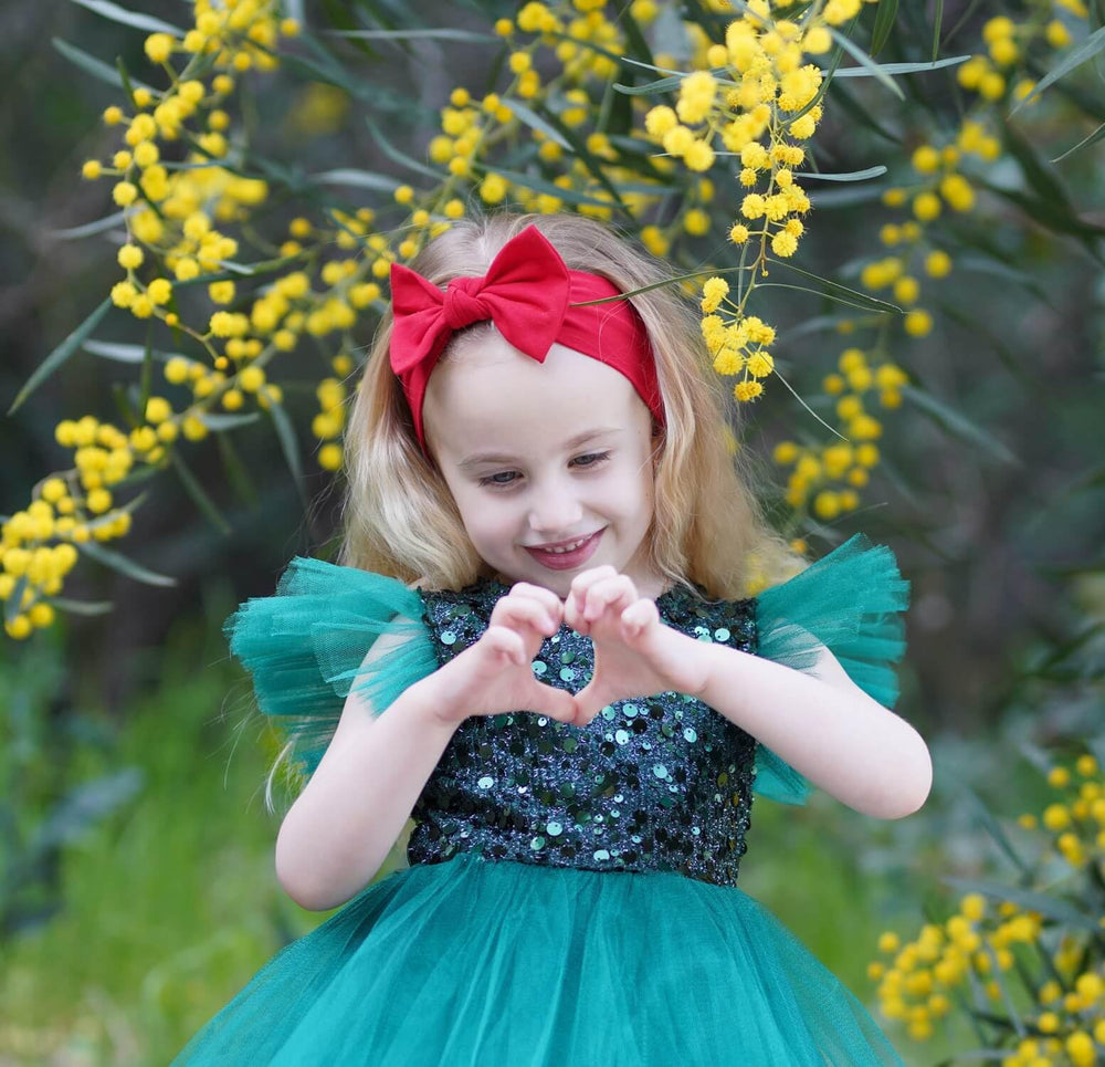 BABYGIZ headband on a baby girl, secure and comfy for all-day wear.