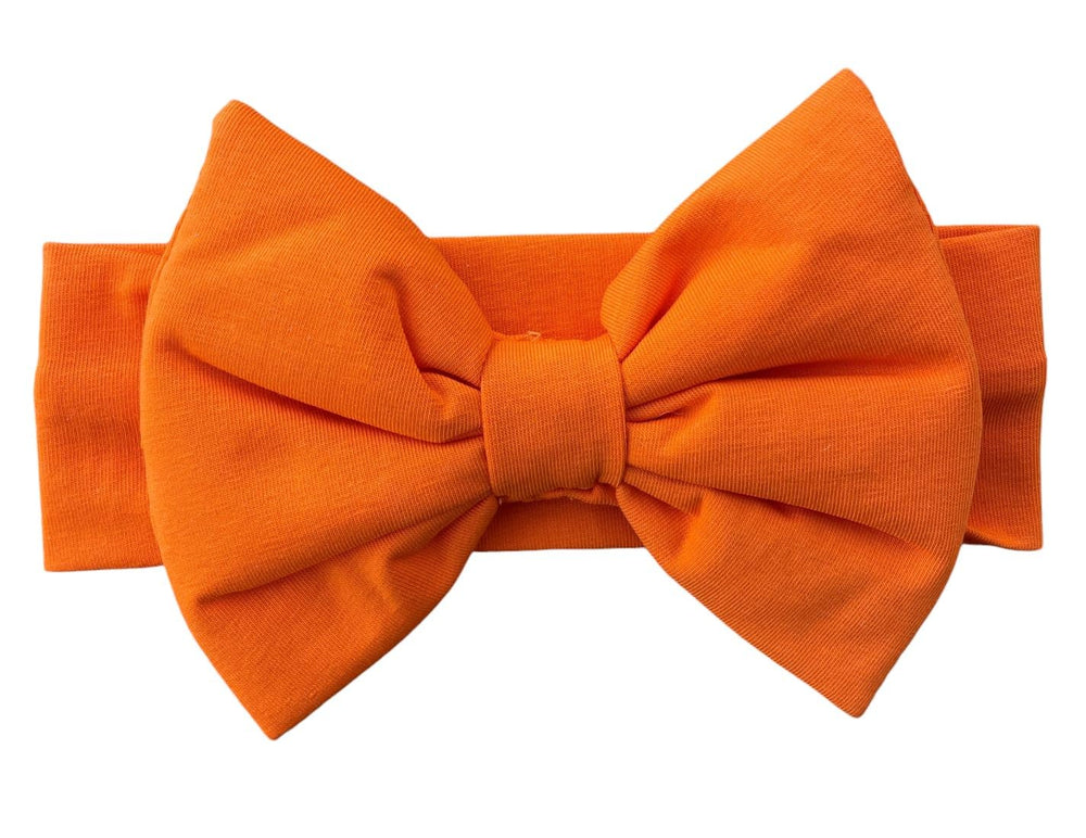 BABYGIZ orange big-bow headband for 0-6 months babies keeps hair away from the face.