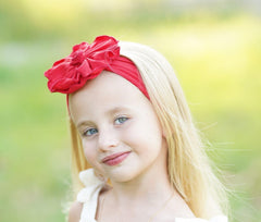 BABYGIZ baby hairband in red with flower adds charm during family events.