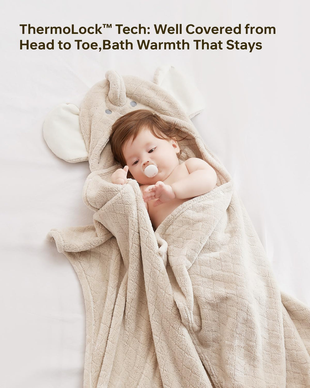 Babygreat hooded towel in use after bath-time, child cuddled and warm.