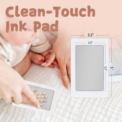 Newborn handprint on card using BabyQunt inkless kit for a clear keepsake