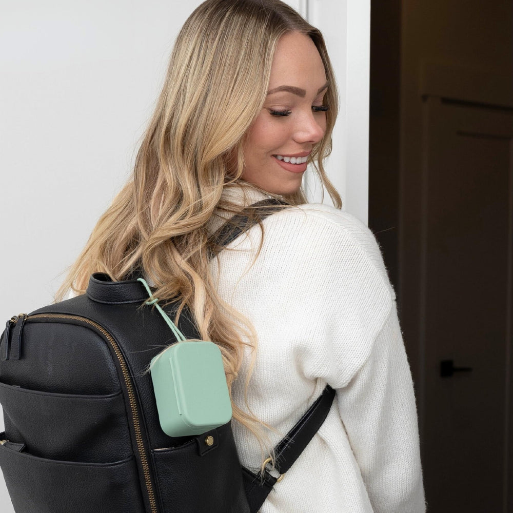 Locking strap secures to bags, strollers, or cribs for convenience.