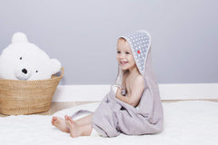 BabyToLove white stars print towel offers cozy, playful design for newborns.