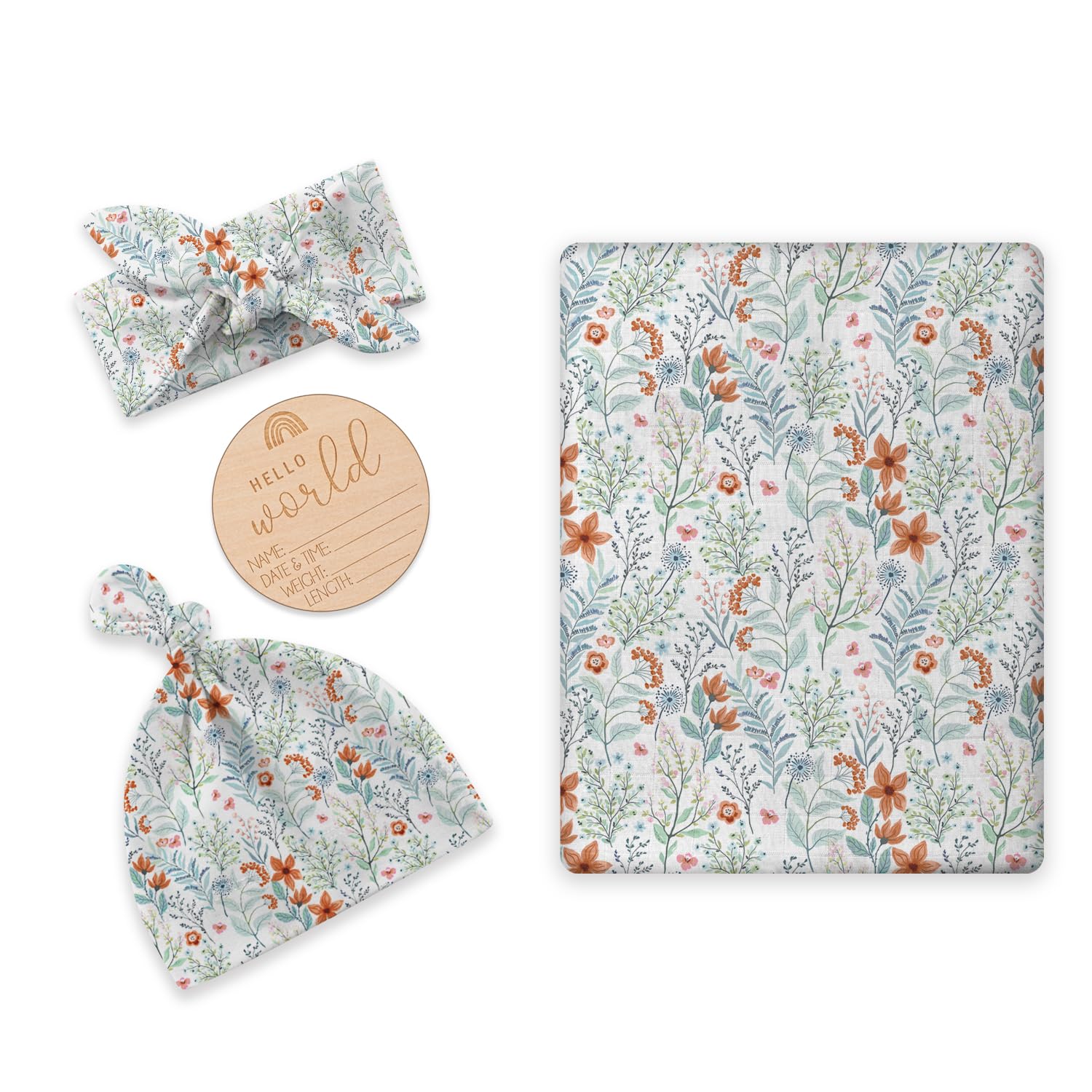 BabyWhale newborn swaddle flatlay with floral green daisy design for gentle baby skin