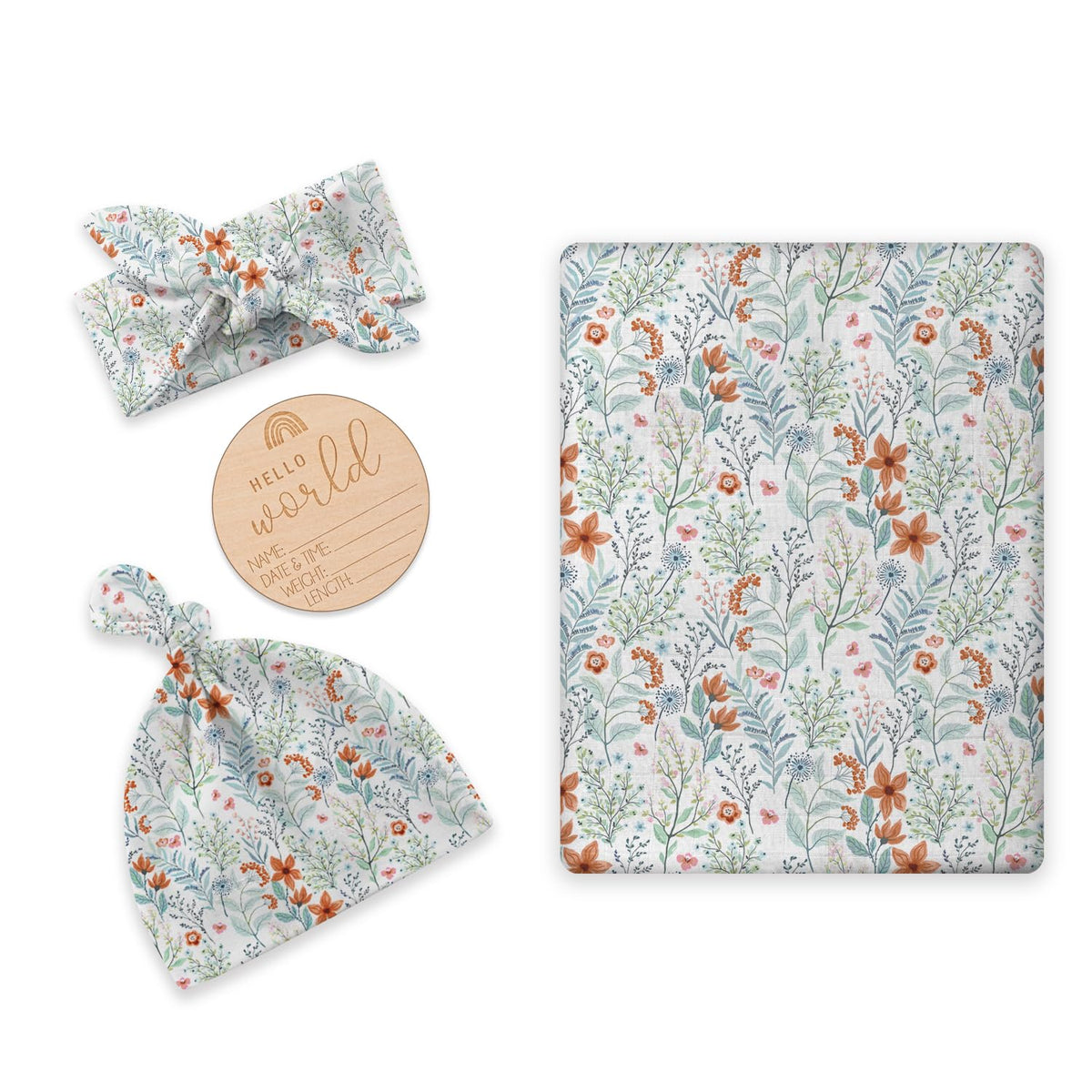 BabyWhale newborn swaddle flatlay with floral green daisy design for gentle baby skin