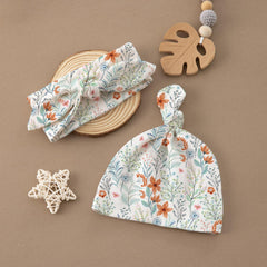 BabyWhale swaddle set displayed with photography prop for newborn portraits