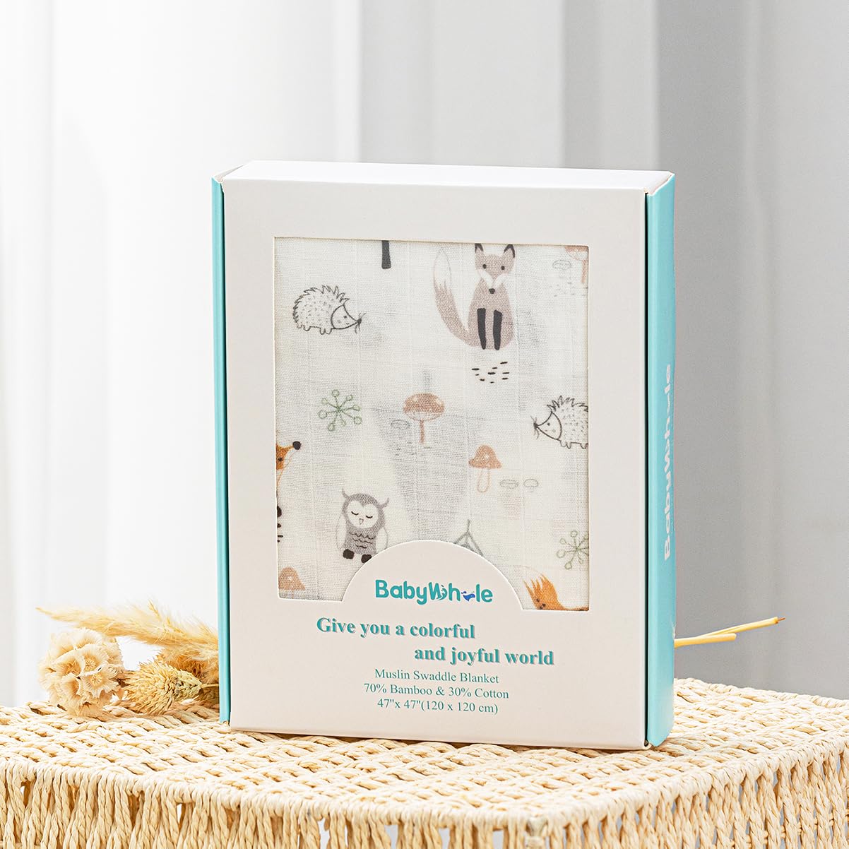 BabyWhale swaddle set with hat and bow headband for adorable wear