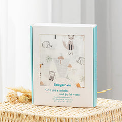 BabyWhale swaddle set with hat and bow headband for adorable wear
