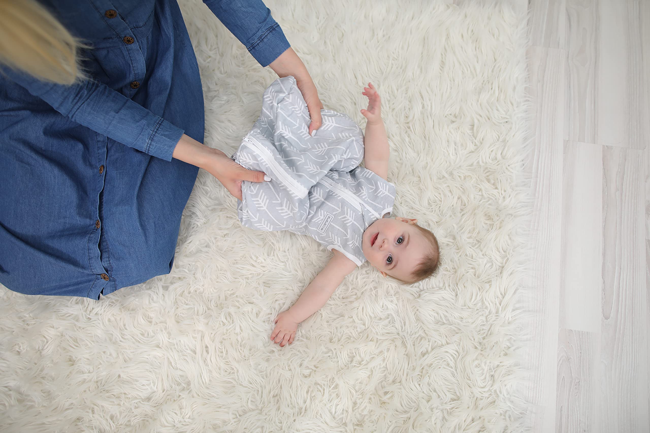 Baebae Goods baby sleep sack beside crib to show bedtime readiness