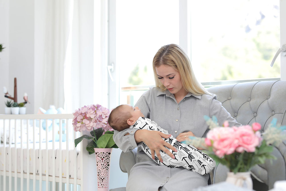 Baebae Goods swaddle wrap in hands demonstrates easy wrapping