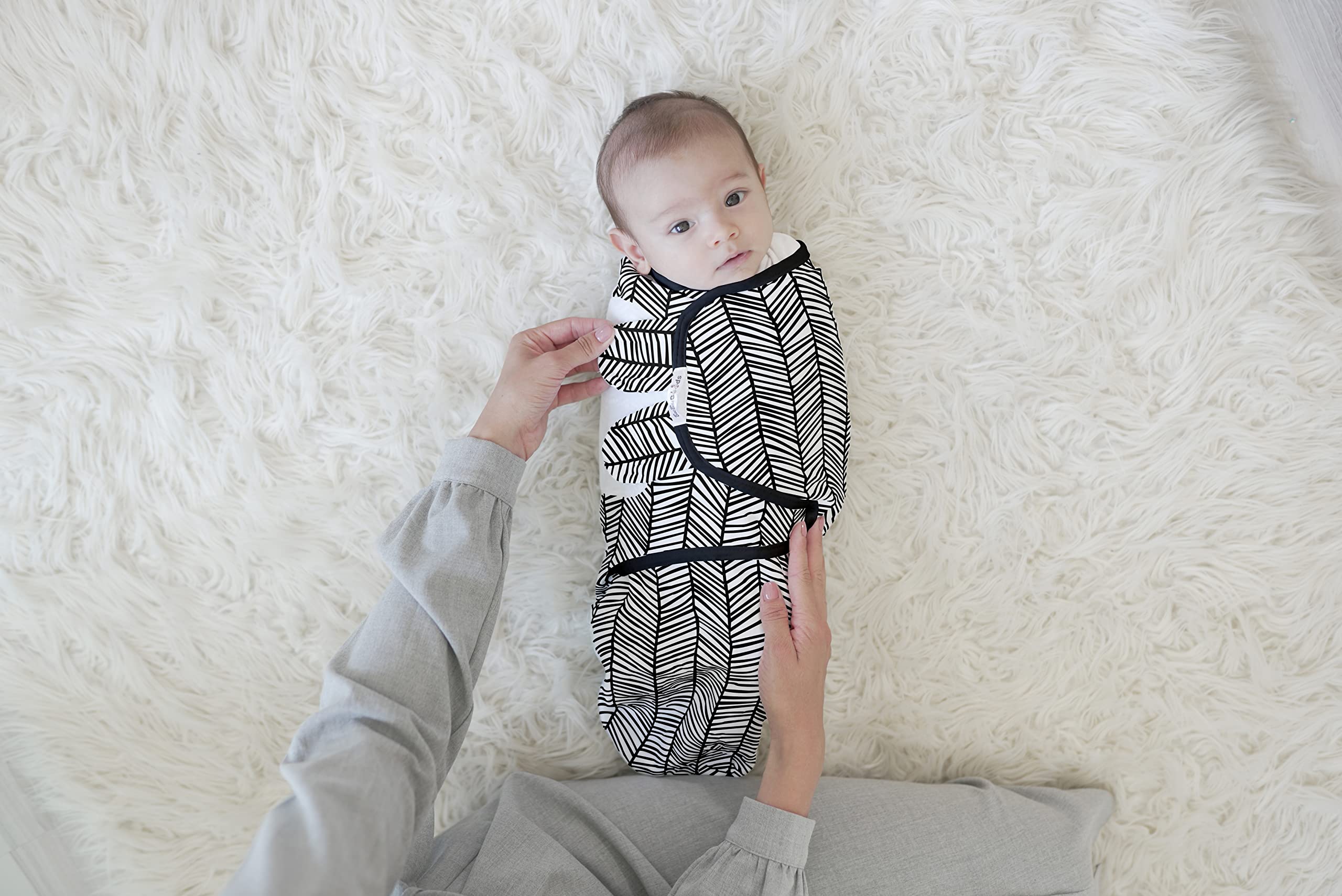 Baebae Goods swaddle wrap on baby for a secure, gentle fit