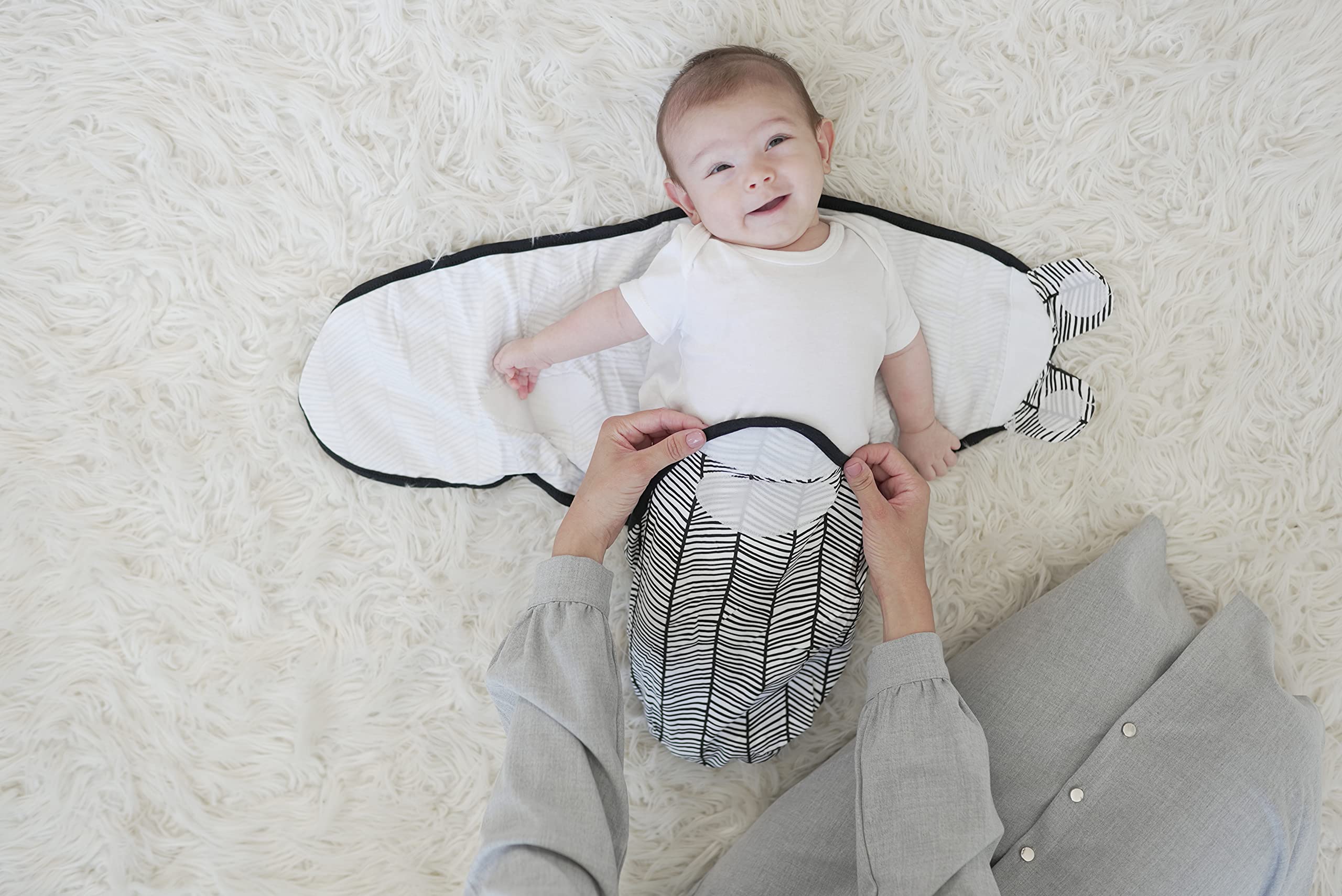 Baebae Goods swaddle wrap with brand tag detail