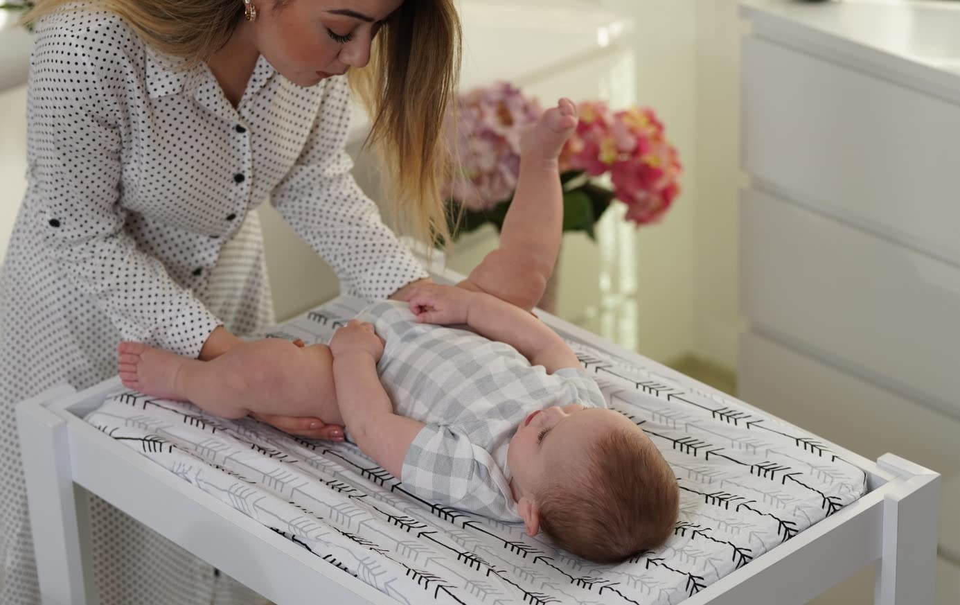 BaeBae Goods cover on a baby changing mat in use.