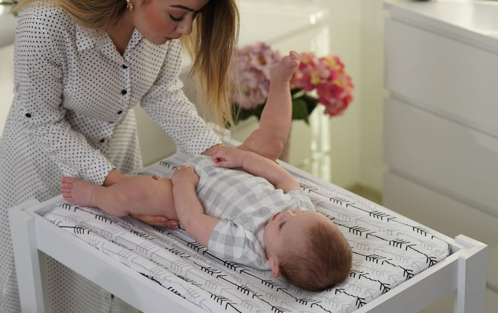 BaeBae Goods cover on a baby changing mat in use.