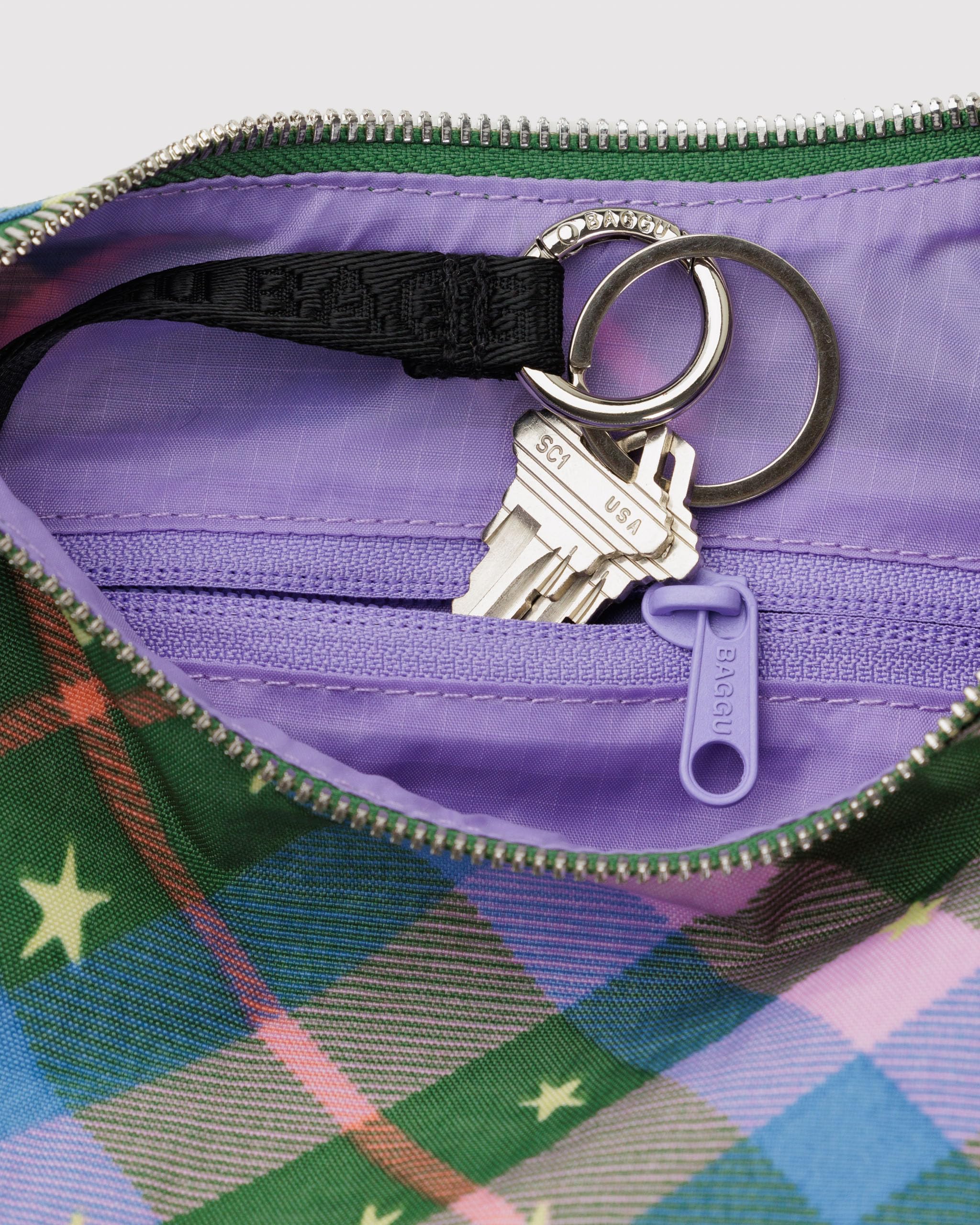 BAGGU Green Star Plaid nylon exterior with adjustable strap for versatile daily use.