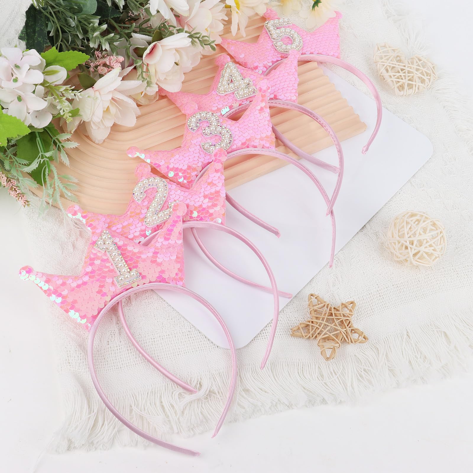 BAHABY pink glitter crown on baby head for a cute look.