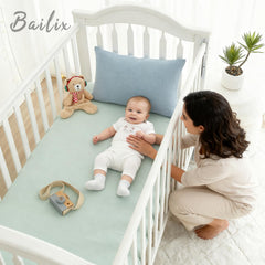 Bailix light-green crib sheet provides soft, hypoallergenic comfort for sensitive skin.