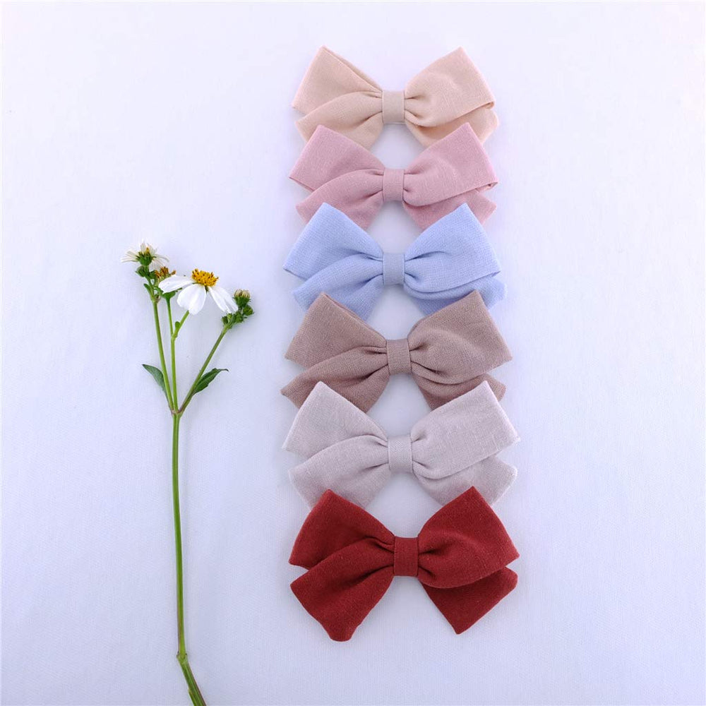 Bailey old gold linen bow clip, chic color for outfits