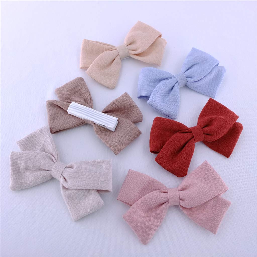Bailey tan linen bow clip, warm neutral for wide outfits