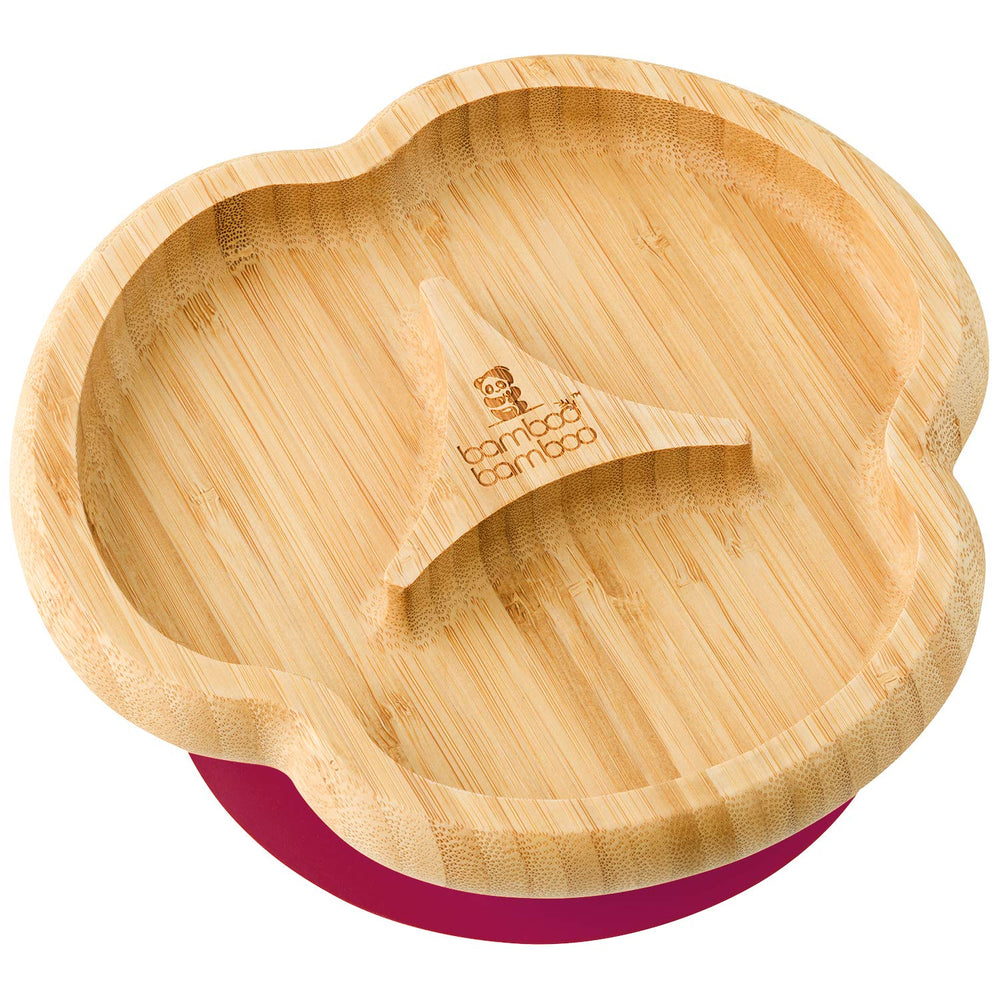 Bamboo Baby Divider Plate with suction base on a table to prevent spills during mealtime.