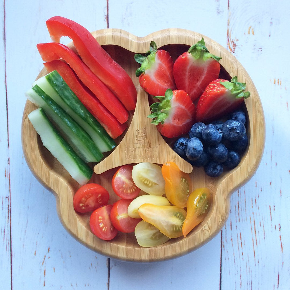 Bamboo Bamboo suction plate on a tray reduces spills during feeding.