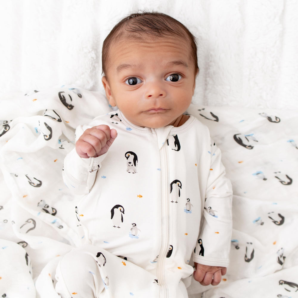 Bamboo Little model wearing the penguin footie for comfortable fit