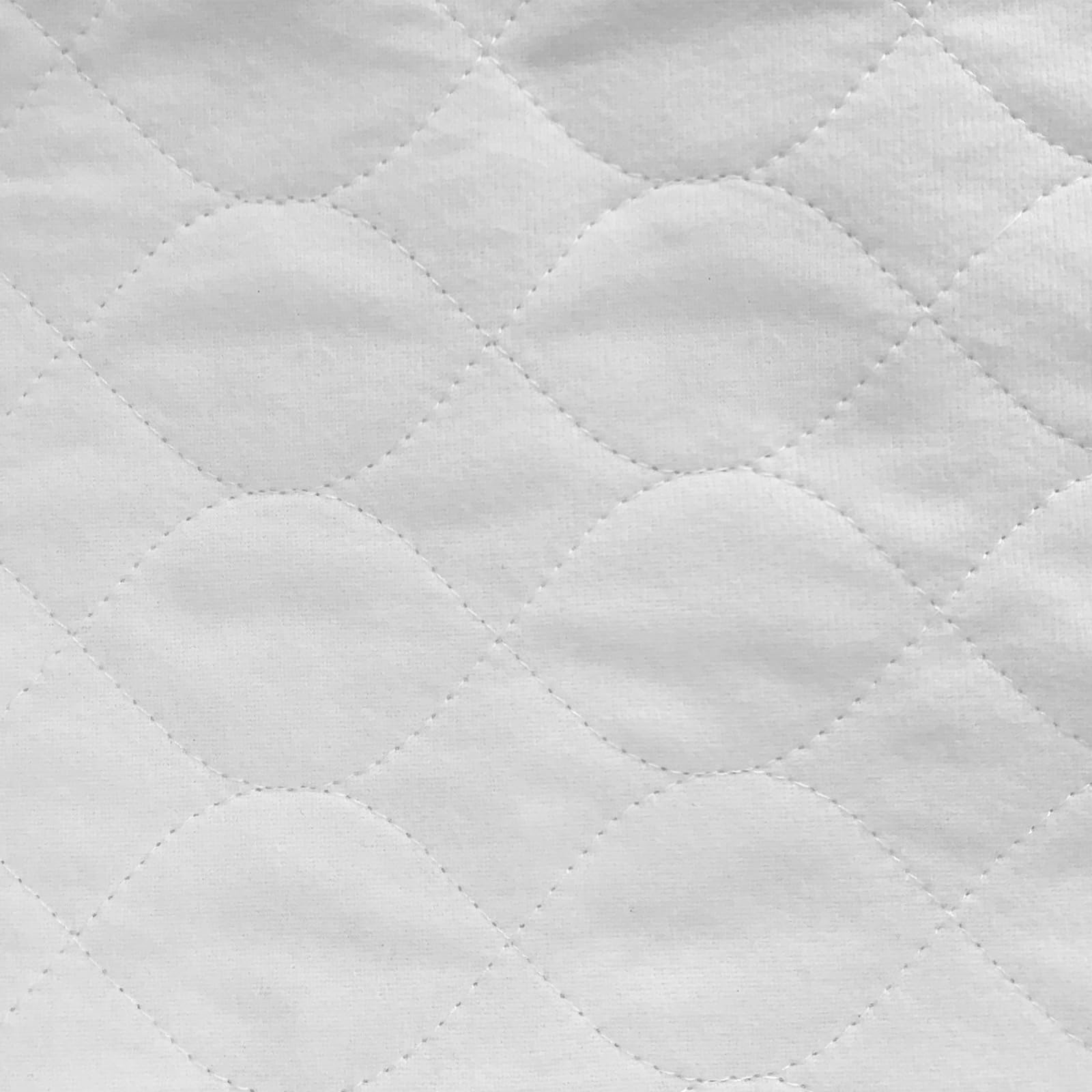 Bamuho bed pad in use protecting bedding during sleep