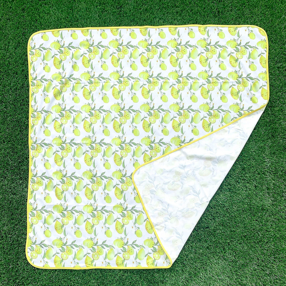 BapronBaby Fresh Lemon Splash Mat folded for travel and portability