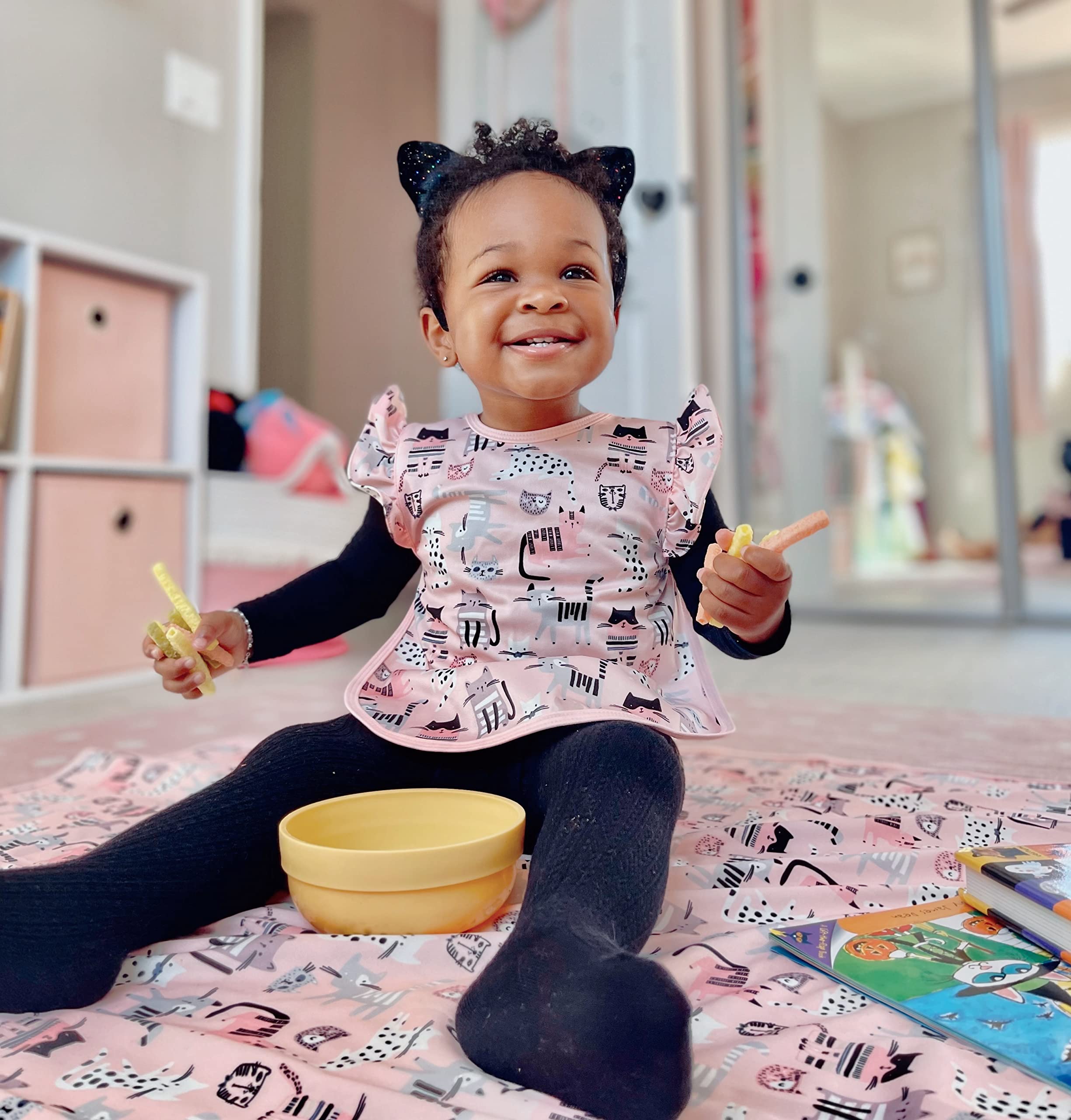 Vibrant Kitty Bapron design adds cheer to family mealtimes.