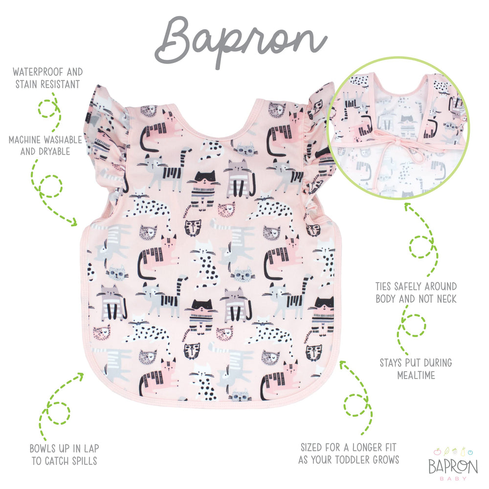 Durable, stain-resistant Kitty Bapron stands up to daily toddler use.