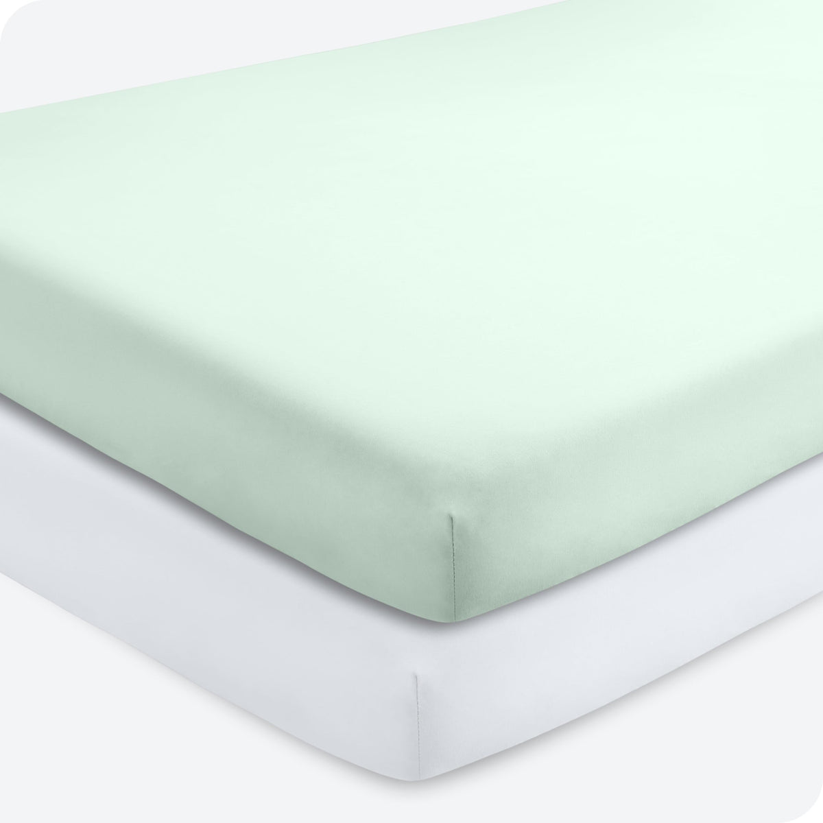 Bare Home 2-pack fitted crib sheets in spring mint and white, ready for bedtime comfort.