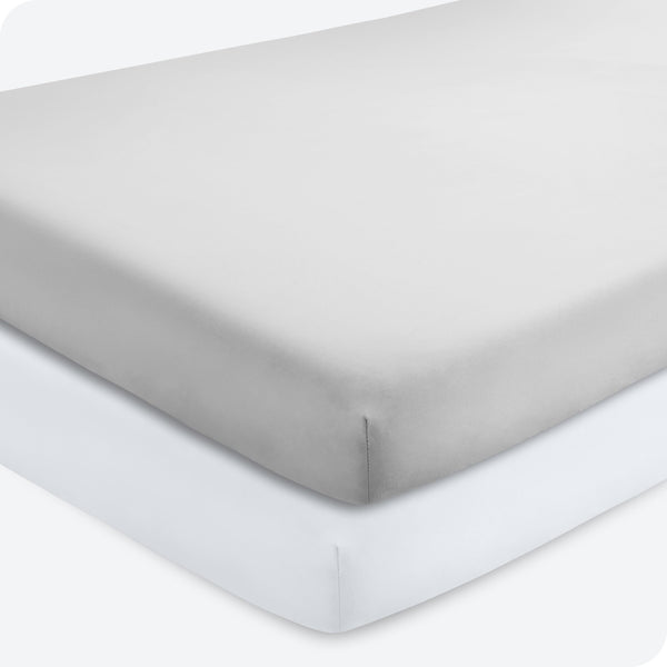 Bare Home 2-pack fitted crib sheets in Cloud Grey and White provide snug mattress fit.