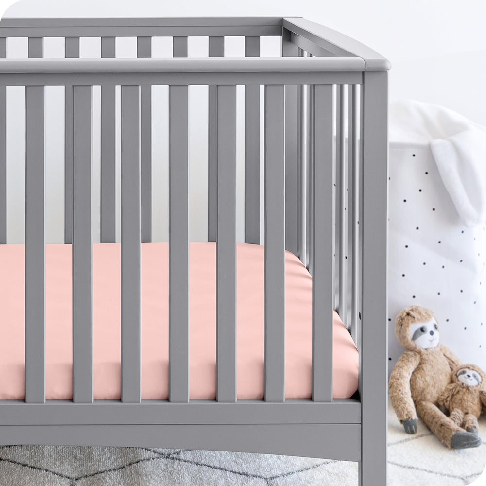 Bare Home 2-pack fitted crib sheets White on a crib for a clean look