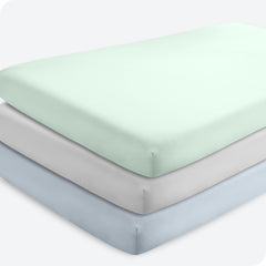 Bare Home three-pack crib sheets in sky blue showing snug fit on a standard crib mattress.