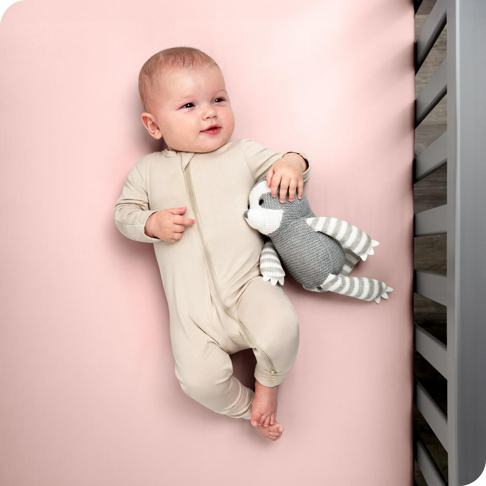 Bare Home fitted crib sheet with elastic edge for a secure fit on standard mattresses.