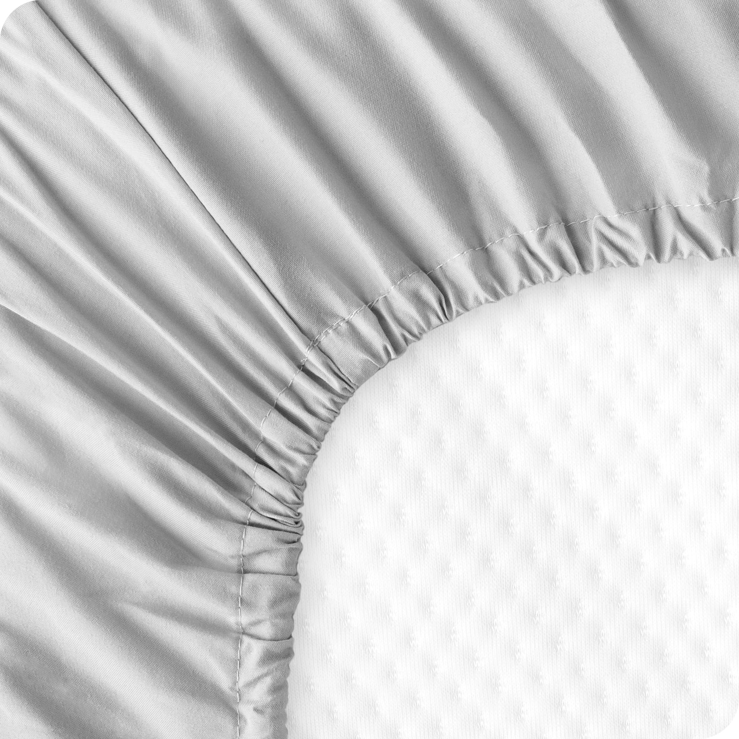 Bare Home mattress-fit crib sheet on standard mattress measures 28x52 inches for secure sleep.