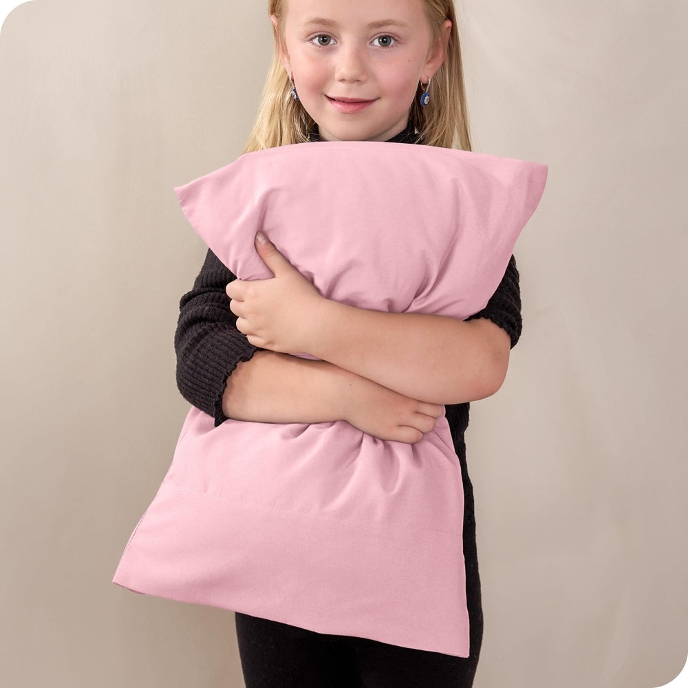 Bare Home light pink toddler pillowcase on bed for nap time