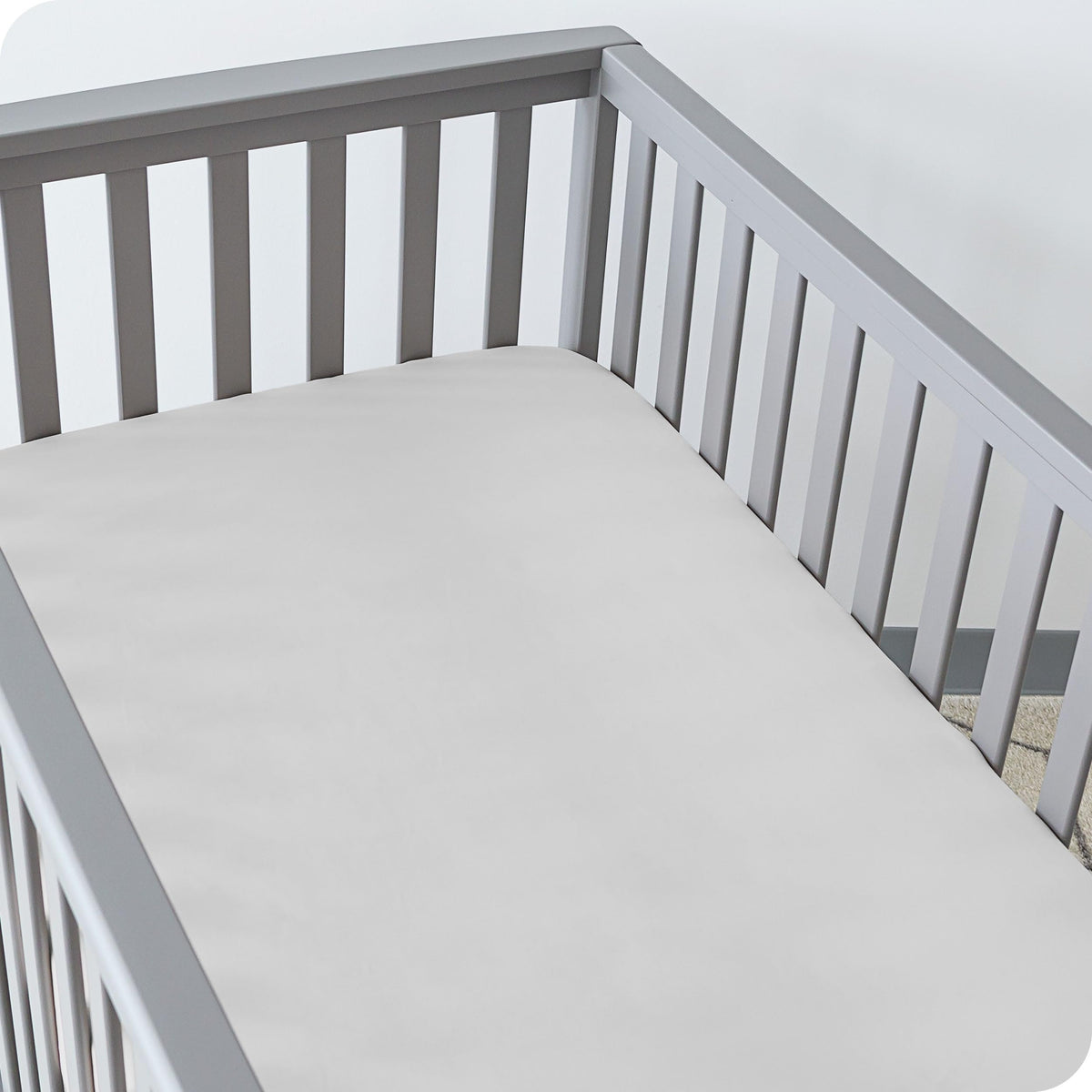 Bare Home Morning Sun 2-pack crib sheets on a standard crib mattress, ultra-soft for peaceful nights.